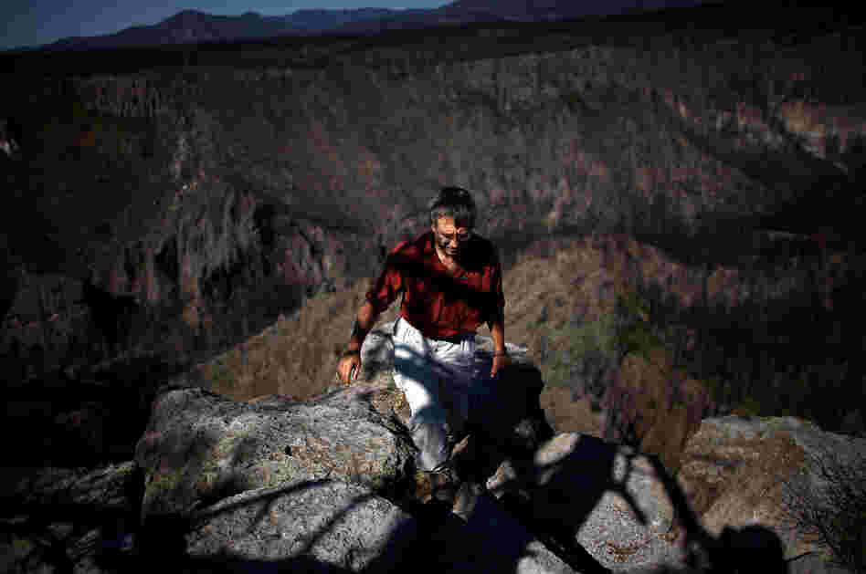 Craig Allen, a research ecologist with the U.S. Geological Survey, walks up a bluff overlooking Cochiti Canyon, which was destroyed by last year's Las Conchas megafire.
