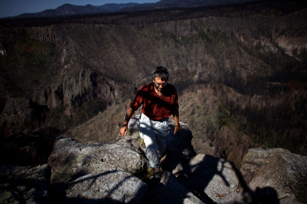 Craig Allen, a research ecologist with the U.S. Geological Survey, walks up a bluff overlooking Cochiti Canyon, which was destroyed by last year's Las Conchas megafire.