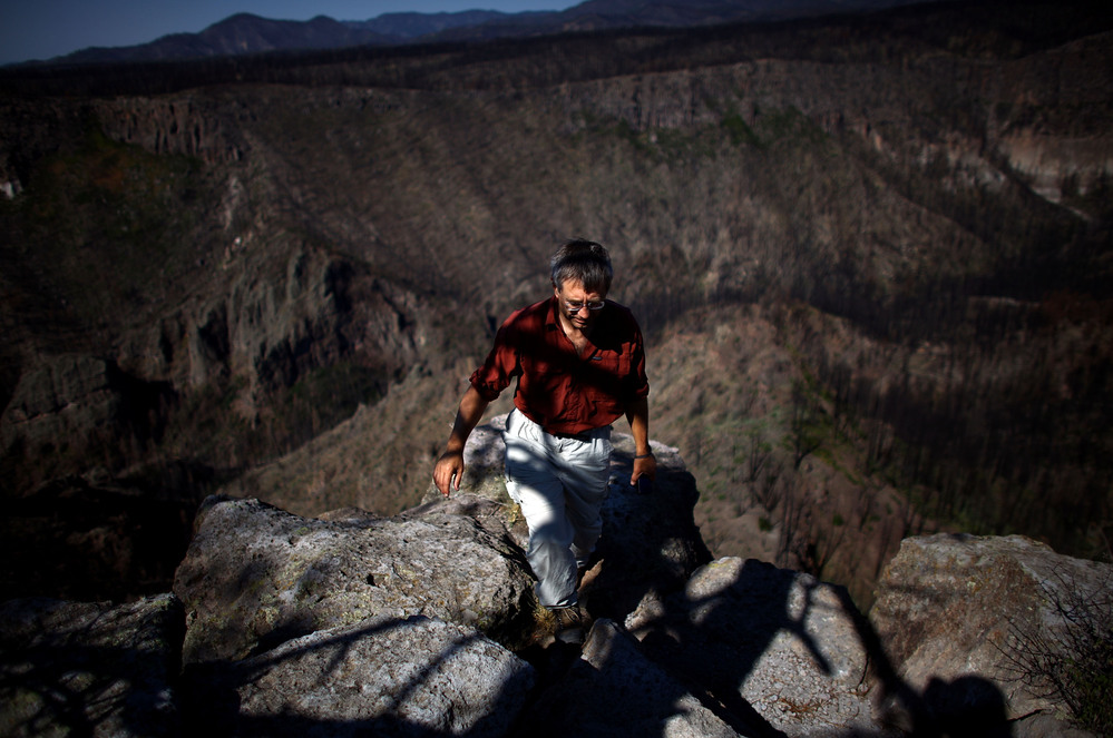 Craig Allen, a research ecologist with the U.S. Geological Survey, walks up a bluff overlooking Cochiti Canyon, which was destroyed by last year's Las Conchas megafire.