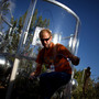 Heath Powers, a project manager at the Los Alamos National Laboratory's "tree torture" lab, climbs through a maze of wiring outside a tree chamber. Heath Powers, a project manager at the Los Alamos National Laboratory's "tree torture" lab, climbs through a maze of wiring outside a tree chamber.