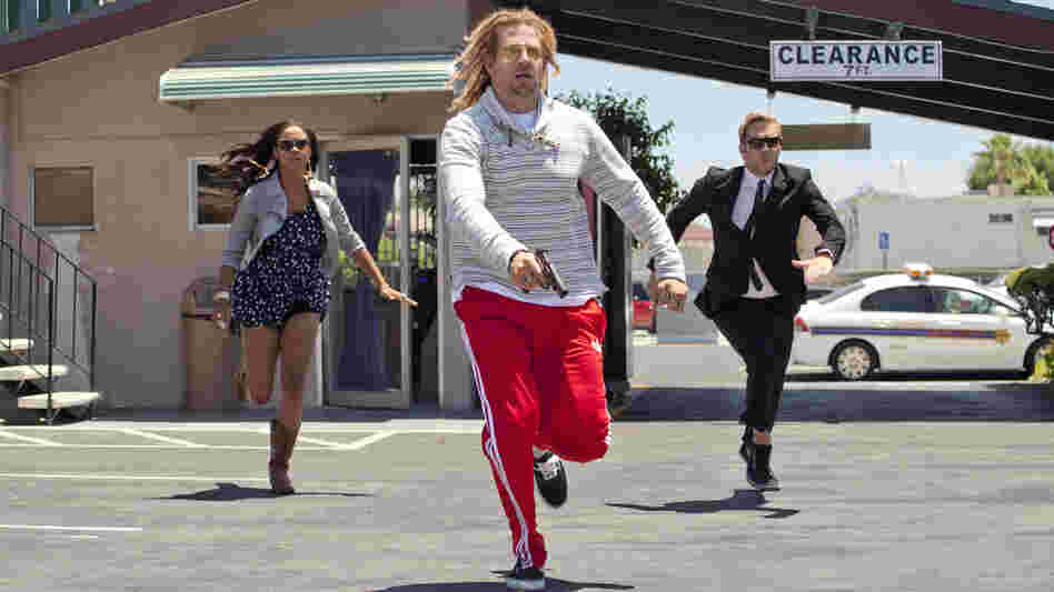A bank robber, played by Bradley Cooper, is in hot pursuit of the runaway protagonists in Hit and Run.