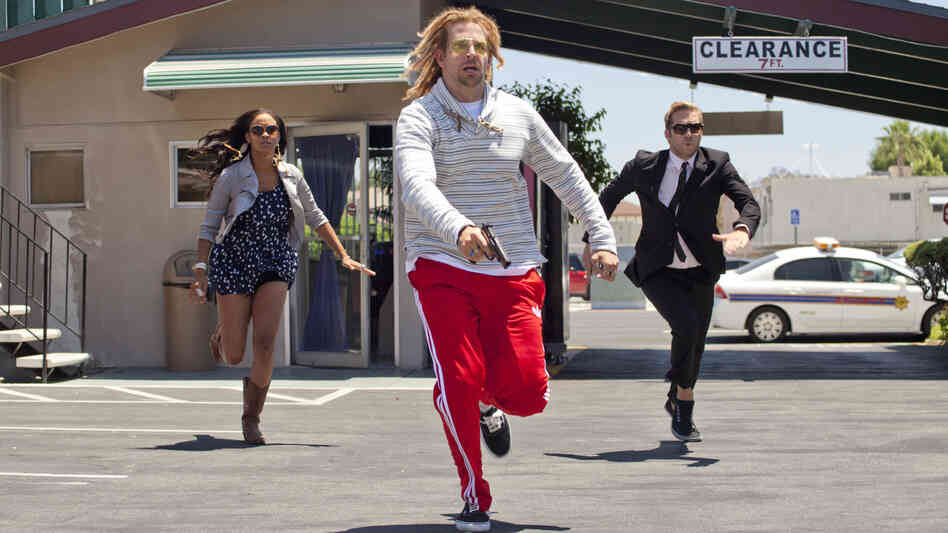 A bank robber, played by Bradley Cooper, is in hot pursuit of the runaway protagonists in Hit and Run.