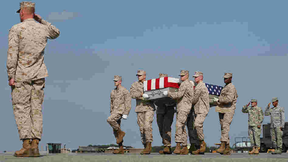 Aug. 13: At Dover Air Force Base in Delaware, the remains of Marine Lance Cpl. Gregory T. Buckley are carried during a dignified transfer. He was killed in a "green on blue" attack.