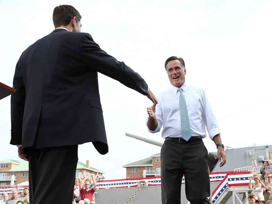 Republican Presidential Candidate Gov. Mitt Romney welcomes running mate Rep. Paul Ryan on stage in Norfolk, Va.