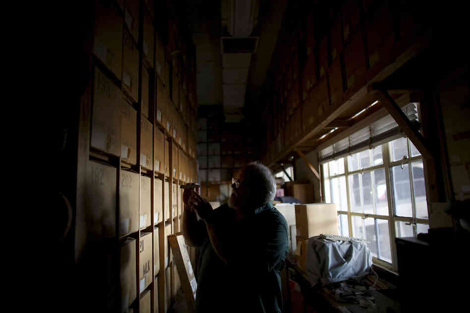 Swetnam stands in the catacombs of storage boxes that house thousands of tree-ring samples. His laboratory is buried under the bleachers of the University of Arizona football stadium.