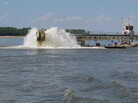 Water gets churned up at the end of a dredging pipeline connected to a U.S. Army Corps of Engineers dredge on the Mississippi River near Memphis, Tenn., on Monday. The river has seen water levels from Illinois to Louisiana plummet because of drought conditions in the past three months. When there's less flow coming downstream, saltwater from the Gulf wedges its way in. Water gets churned up at the end of a dredging pipeline connected to a U.S. Army Corps of Engineers dredge on the Mississippi River near Memphis, Tenn., on Monday. The river has seen water levels from Illinois to Louisiana plummet because of drought conditions in the past three months. When there's less flow coming downstream, saltwater from the Gulf wedges its way in.