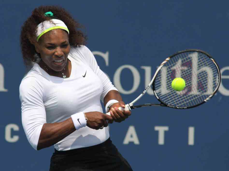 Serena Williams returns a shot during a match at the Western & Southern Open tennis tournament in Mason, Ohio.