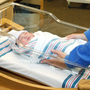 Nurse Angie Hagen tends to a newborn boy in the nursery at Denver Health medical facility in Denver in June 2011. The following month Colorado ended coverage for routine circumcisions under Medicaid.