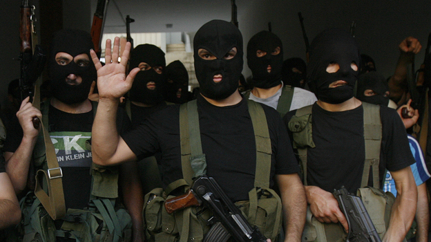 Lebanese masked gunmen from the al-Mokdad clan gather for a news conference in Beirut's southern suburbs on Aug. 15. The Mokdads, a large Lebanese Shiite Muslim clan, said they kidnapped at least 20 Syrians to try to secure the release of a family member abducted by Syrian rebels near Damascus this week. Lebanese masked gunmen from the al-Mokdad clan gather for a news conference in Beirut's southern suburbs on Aug. 15. The Mokdads, a large Lebanese Shiite Muslim clan, said they kidnapped at least 20 Syrians to try to secure the release of a family member abducted by Syrian rebels near Damascus this week.