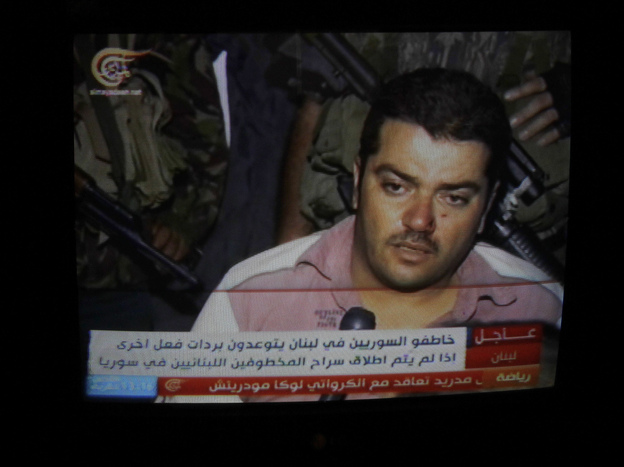 One of 20 Syrians kidnapped by the Mokdad family is seen in footage broadcast on Lebanese TV in Beirut, on Aug. 15.