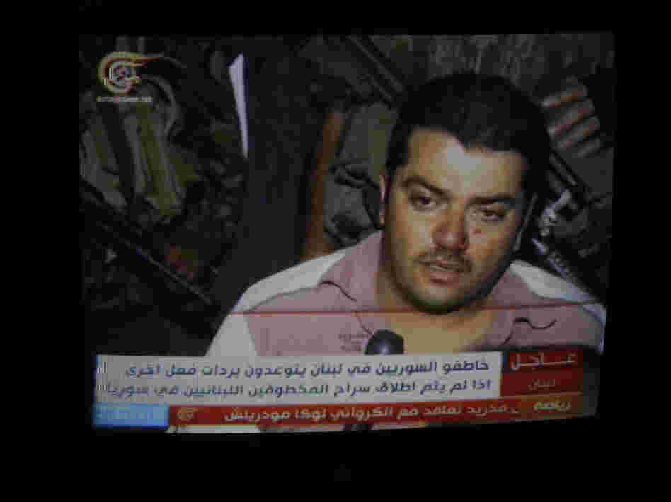 One of 20 Syrians kidnapped by the Mokdad family is seen in footage broadcast on Lebanese TV in Beirut, on Aug. 15.