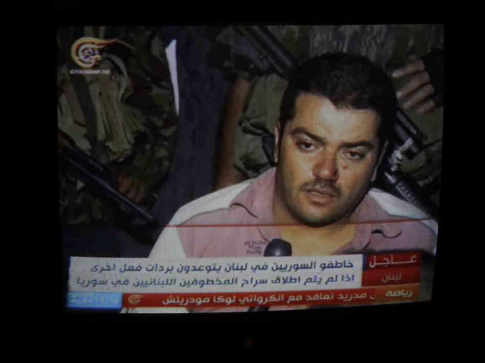 One of 20 Syrians kidnapped by the Mokdad family is seen in footage broadcast on Lebanese TV in Beirut, on Aug. 15.