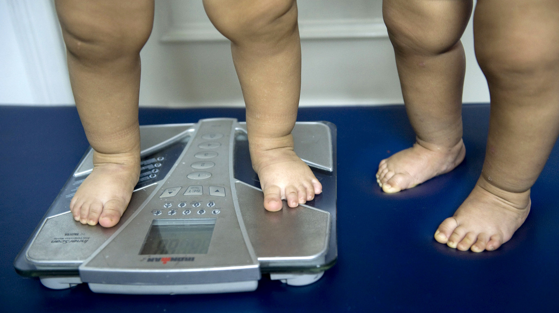 Childhood obesity is on the rise in many countries and overuse of antibiotics is now on the radar as a possible factor in the epidemic. Here 18-month-old twins are weighed in a nutritionist's office in Colombia.