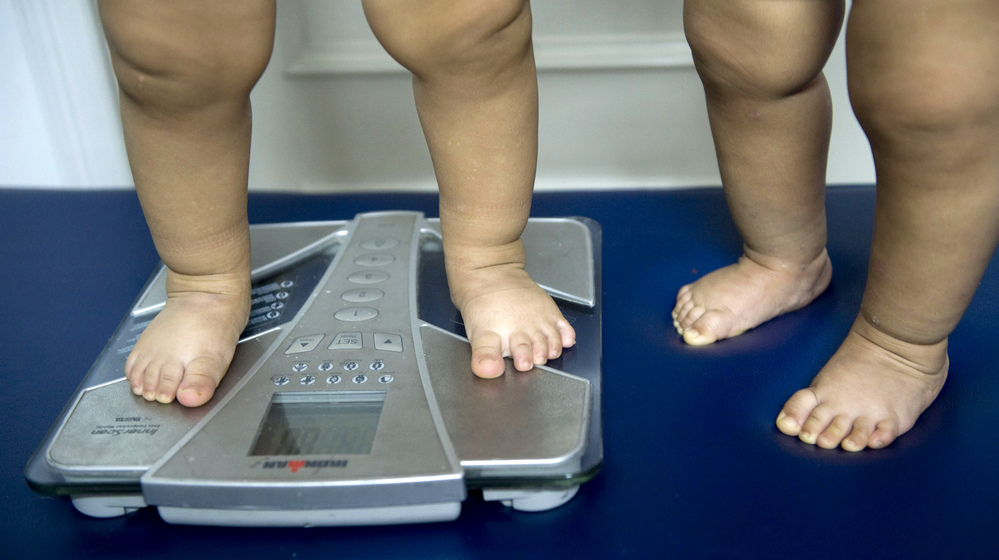 Childhood obesity is on the rise in many countries and overuse of antibiotics is now on the radar as a possible factor in the epidemic. Here 18-month-old twins are weighed in a nutritionist's office in Colombia.