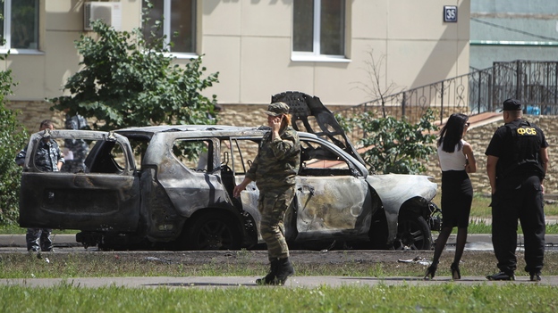 Police examine the site of a car bomb in the Russian city of Kazan on July 19. Ildus Faizov, the mufti of Tatarstan and the top Islamic leader in the region, was wounded in the explosion, while his deputy, Valiulla Yakupov, was shot dead in a separate incident on the same day.