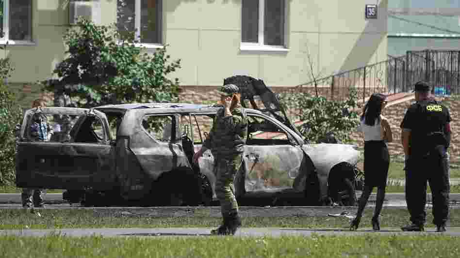 Police examine the site of a car bomb in the Russian city of Kazan on July 19. Ildus Faizov, the mufti of Tatarstan and the top Islamic leader in the region, was wounded in the explosion, while his deputy, Valiulla Yakupov, was shot dead in a separate incident on the same day.