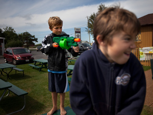 Wendt's grandchildren, Zach, 9, and Sawyer, 6, play with Nerf guns outside the family restaurant.