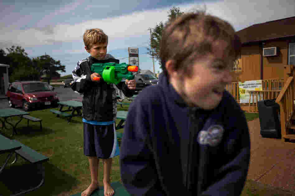 Wendt's grandchildren, Zach, 9, and Sawyer, 6, play with Nerf guns outside the family restaurant.