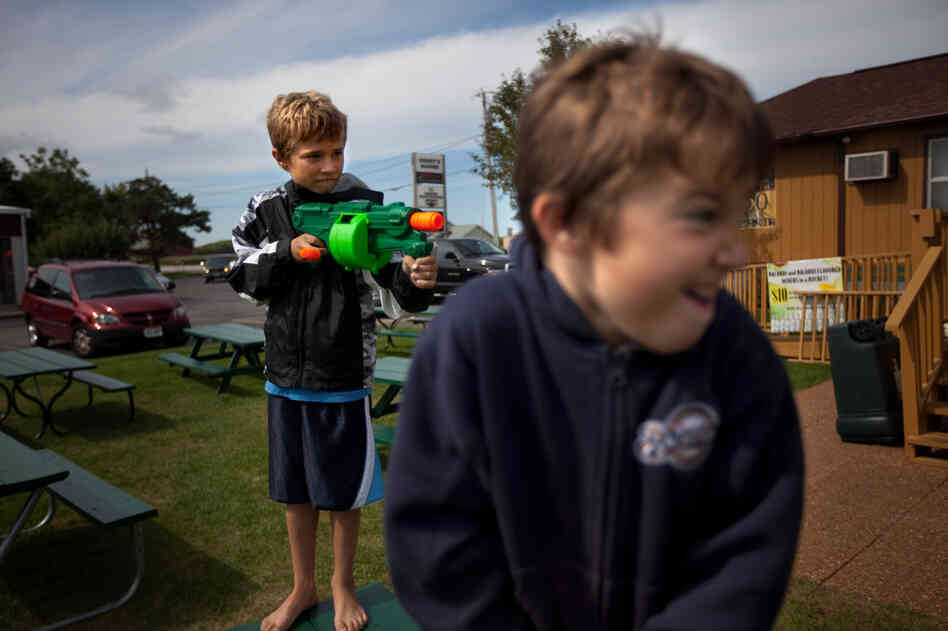 Wendt's grandchildren, Zach, 9, and Sawyer, 6, play with Nerf guns outside the family restaurant.