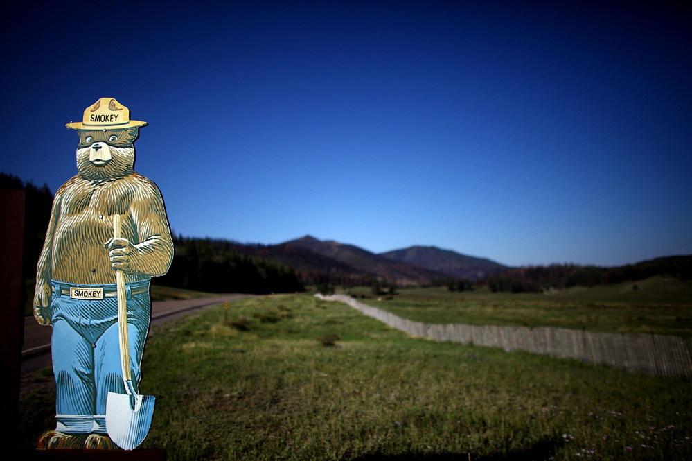 A Smokey the Bear fire prevention sign sits in Valles Caldera along Highway 4, which was one of the front lines in fighting the Las Conchas Fire in 2011.