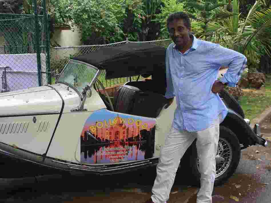 Cuba has tight advertising restrictions, so Cedric Fernando uses his British-made 1955 MG convertible to spread the word about his Indian restaurant, Bollywood, in Havana.