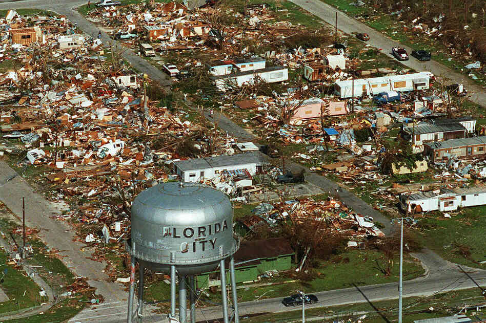 A water tower stands over the ruins of the coastal community of Florida City. Two decades later, Florida City and nearby Homestead have doubled in size.