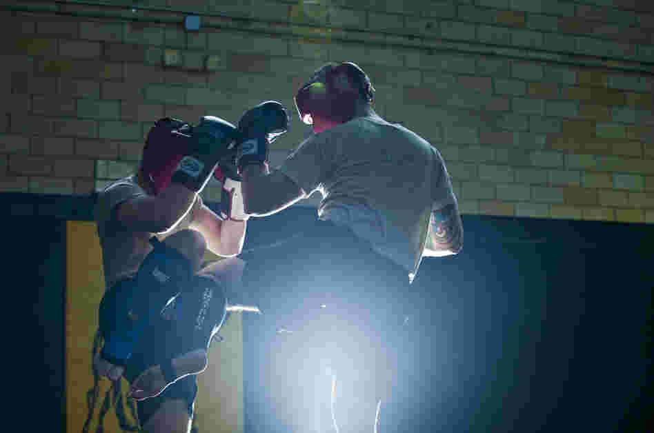 Student instructors take turns practicing maneuvers during a sparring session at the U.S. Army Combatives school at Fort Benning.