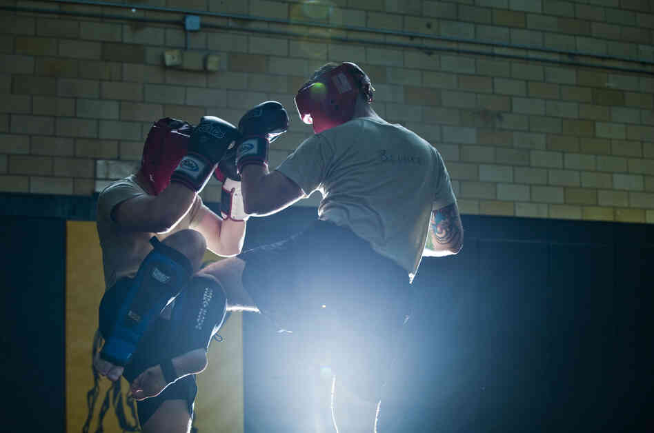 Student instructors take turns practicing maneuvers during a sparring session at the U.S. Army Combatives school at Fort Benning.