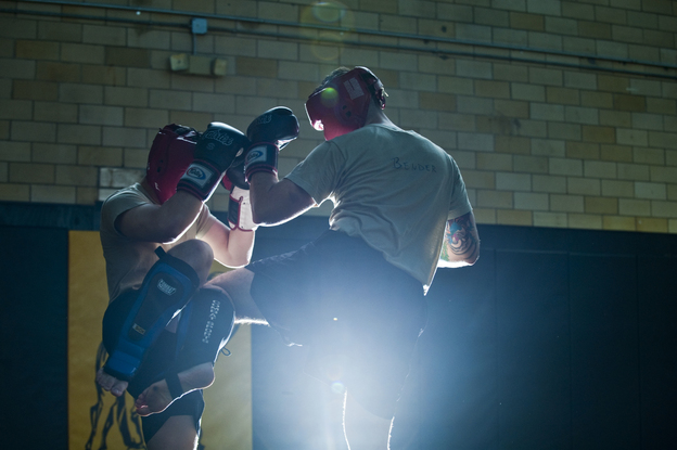 Student instructors take turns practicing maneuvers during a sparring session at the U.S. Army Combatives school at Fort Benning.