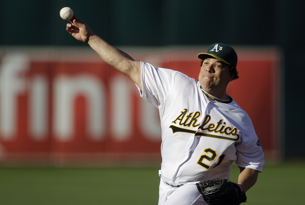 Oakland Athletics pitcher Bartolo Colon works against the Cleveland Indians in the first inning of a baseball game Aug. 18, 2012, in Oakland.