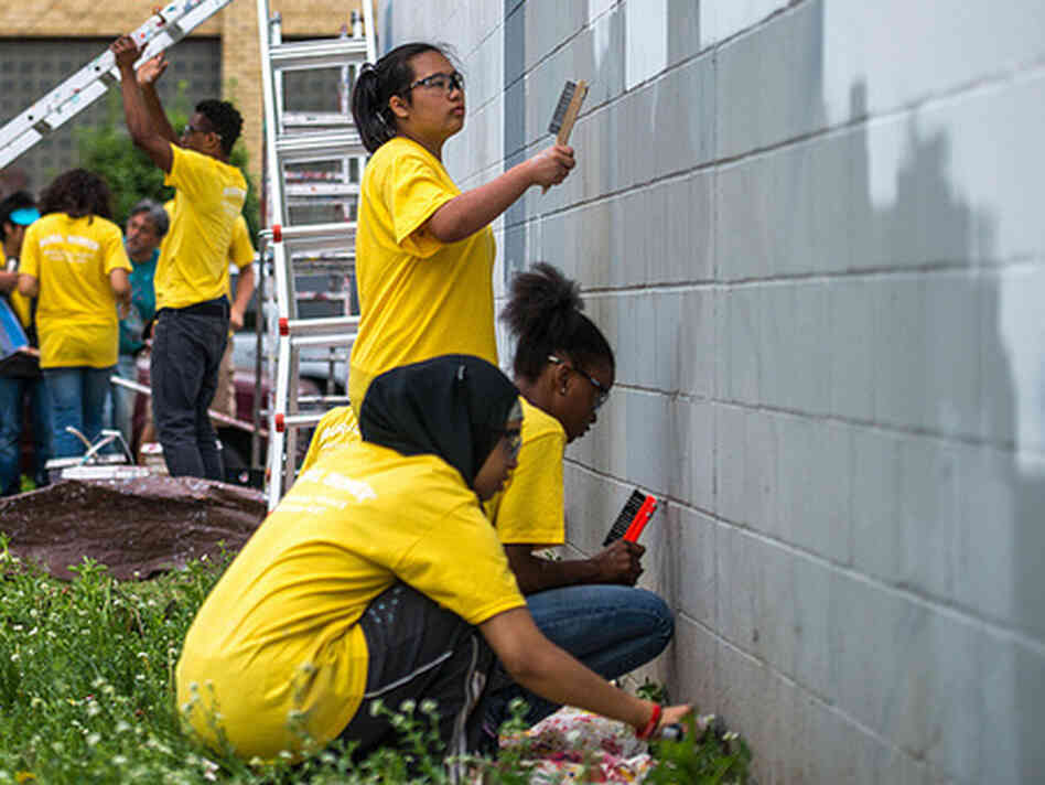 Preparing a wall for a mural.