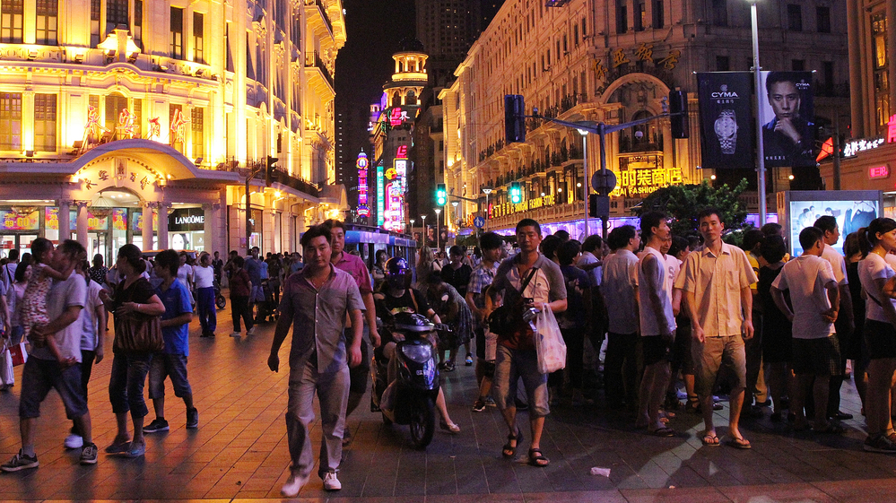 In 1999, Shanghai turned Nanjing Road, the city's most famous shopping area, into a walking street. On summer nights, thousands fill the street, surrounded by colonial architecture and riotous neon signs.