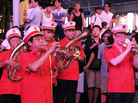 The "Loving Happiness Band," supported, in part, by the Communist Party, plays for a crowd on Nanjing Road. The "Loving Happiness Band," supported, in part, by the Communist Party, plays for a crowd on Nanjing Road.