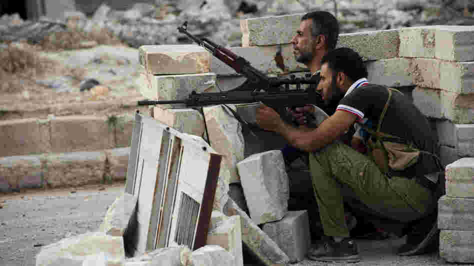The daily fighting in Syria included this gun battle Wednesday involving rebels in the northern city of Aleppo. Still, the rival sides recently worked out a prisoner swap in which two women were freed from state custody, while the rebels released seven pro-government fighters.