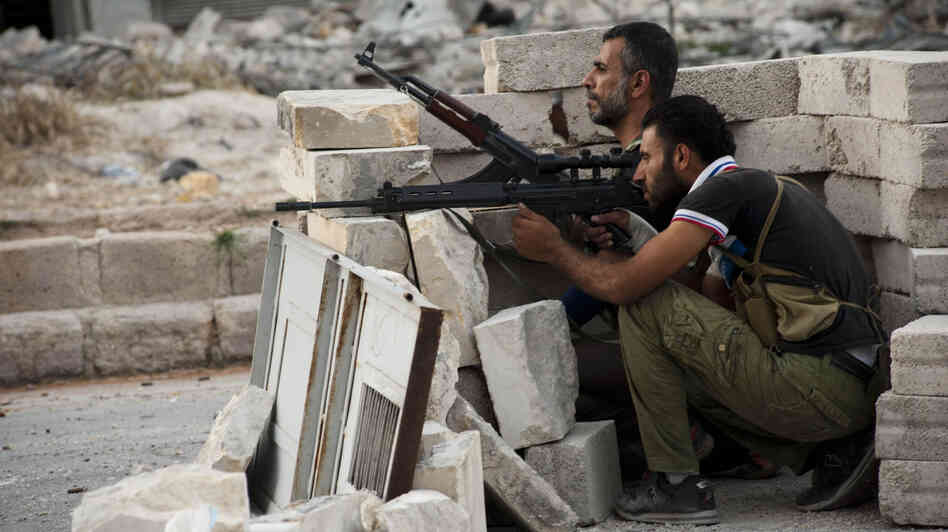 The daily fighting in Syria included this gun battle Wednesday involving rebels in the northern city of Aleppo. Still, the rival sides recently worked out a prisoner swap in which two women were freed from state custody, while the rebels released seven pro-government fighters.