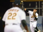 Adam Rosales of the Oakland Athletics gets his throw off to Chris Carter at first base to complete Tuesday night's triple play. Adam Rosales of the Oakland Athletics gets his throw off to Chris Carter at first base to complete Tuesday night's triple play.