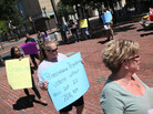 Protesters hold signs in Allentown, Pa., om July 25 as the Commonwealth Court holds hearings on voter ID laws. Protesters hold signs in Allentown, Pa., om July 25 as the Commonwealth Court holds hearings on voter ID laws.