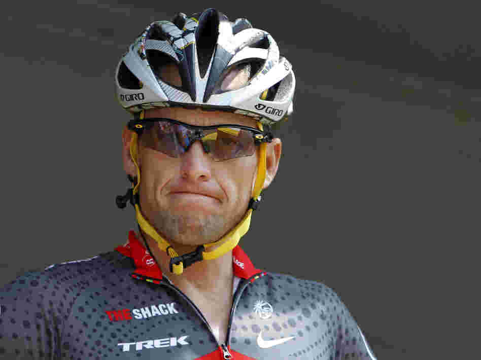 Lance Armstrong grimaces prior to the start of the third stage of the Tour de France cycling race in Wanze, Belgium, on July 6, 2010. Armstrong said Thursday he is finished fighting charges from the U.S. Anti-Doping Agency that he used performance-enhancing drugs during his unprecedented cycling career.