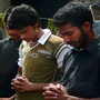 Christians pray for Rimsha on the roof of their priest's compound. Hundreds of the girl's Christian neighbors have fled their homes, fearing attacks by Muslims.