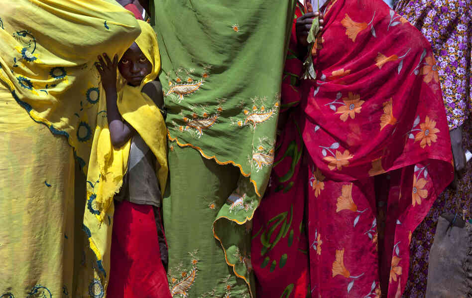 Families wait for hours to register at the Yida refugee camp in South Sudan along the northern border in early July. Within a few weeks, the population of the camp more than doubled, leading to shortages of food, water and medicine.