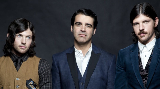 The Avett Brothers are real-life siblings Scott (left) and Seth Avett (right), and bass player Bob Crawford. The band's newest album is The Carpenter.