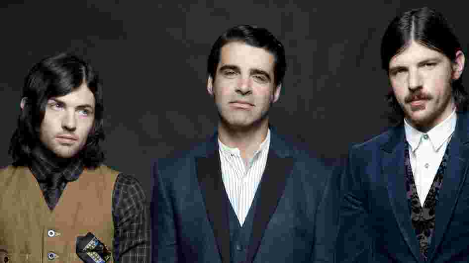 The Avett Brothers are real-life siblings Scott (left) and Seth Avett (right), and bass player Bob Crawford. The band's newest album is The Carpenter.