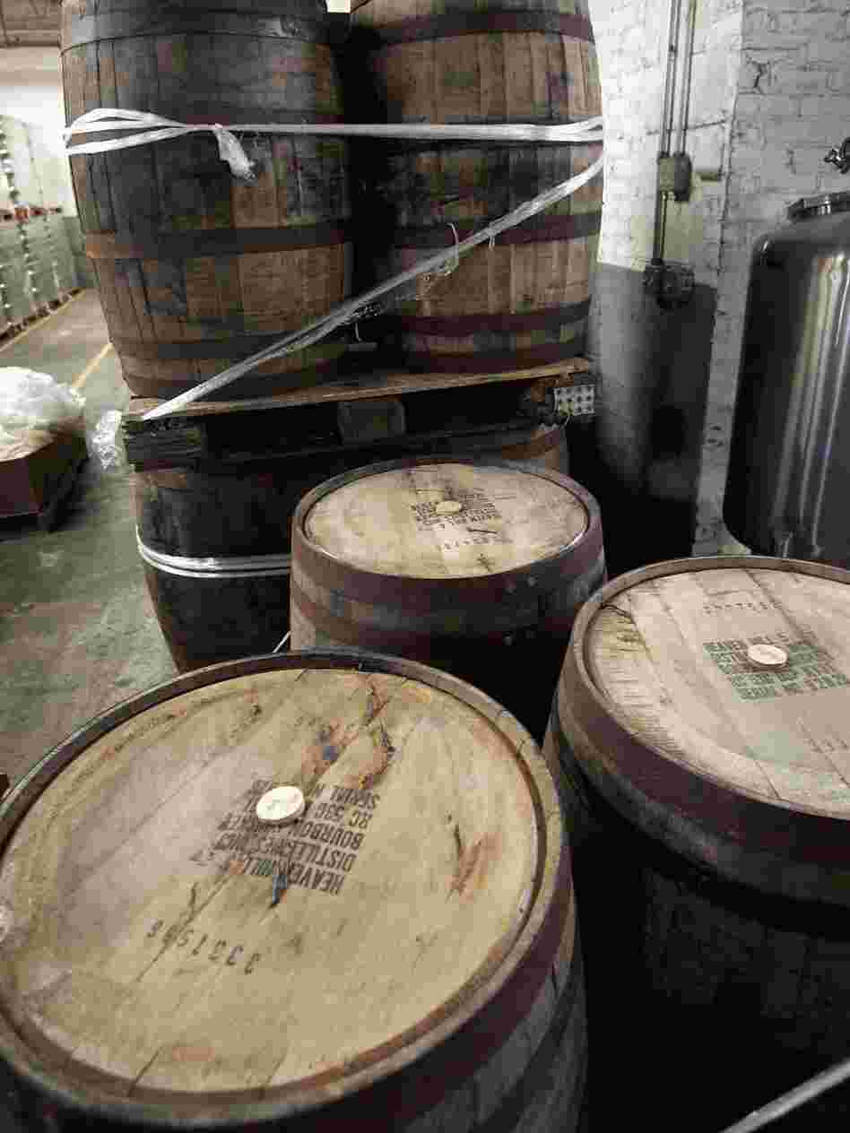 Used bourbon barrels like these at the Goose Island Brewery in Chicago are finding new life by bringing distinctive flavor to beer, cocktails and hot sauce.