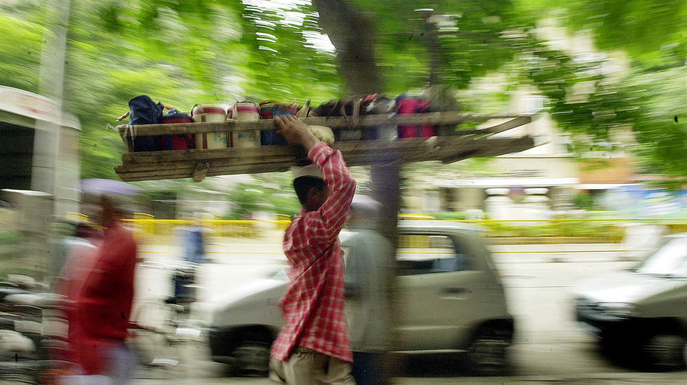 Dabba wallahs carry lunchboxes to offices in Indian cities. But the old tradition is changing with modern times.