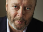 Christopher Hitchens, who died in December 2011 from complications related to esophageal cancer, was a columnist for Vanity Fair, and the author of Hitch-22 and God Is Not Great. Christopher Hitchens, who died in December 2011 from complications related to esophageal cancer, was a columnist for Vanity Fair, and the author of Hitch-22 and God Is Not Great.