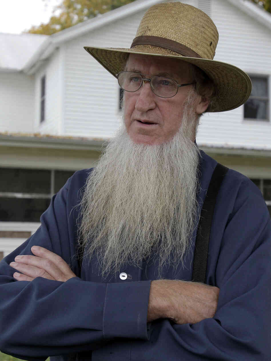 Sam Mullet, in the front yard of his home in Bergholz, Ohio, last year, is one of 16 people charged in beard- and hair- cutting attacks on fellow Amish. Mullet denies being involved in the attacks.