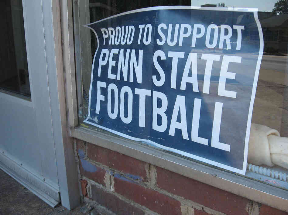 Signs on display around town are designed to show support for Penn State's football team as a new season begins.