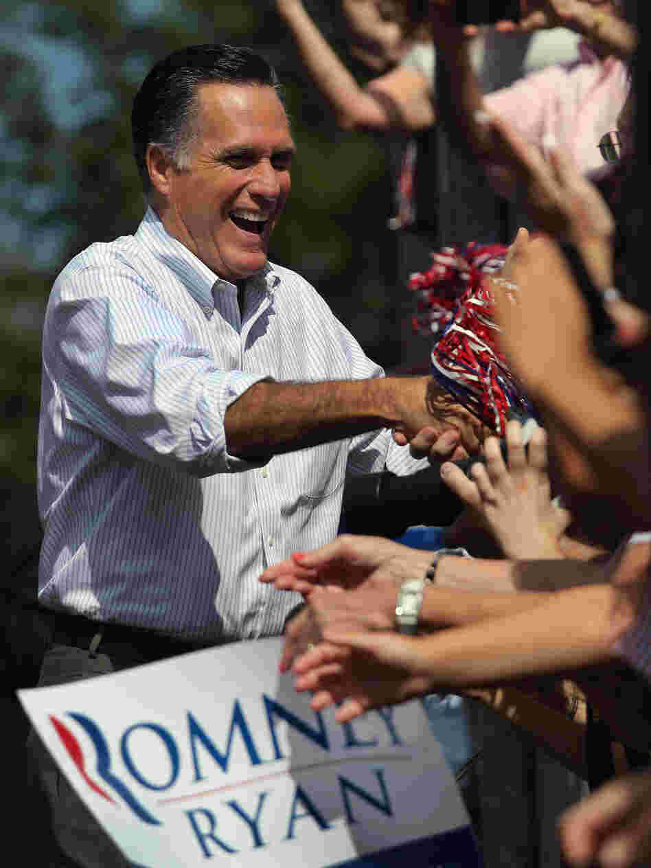 Mitt Romney greets supporters during a campaign stop at Saint Anselm College on August 20 in Manchester, N.H.