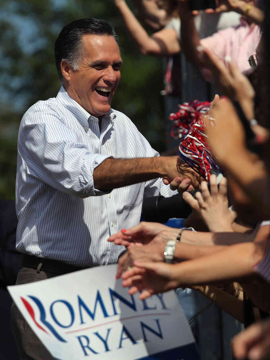 Mitt Romney greets supporters during a campaign stop at Saint Anselm College on August 20 in Manchester, N.H.
