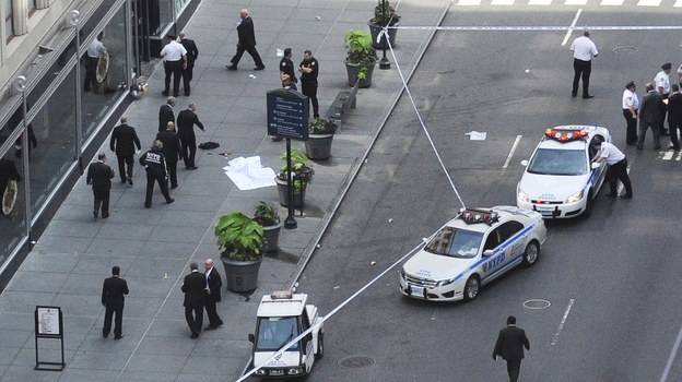 Police investigate a shooting at the Empire State Building in New York on Friday.
